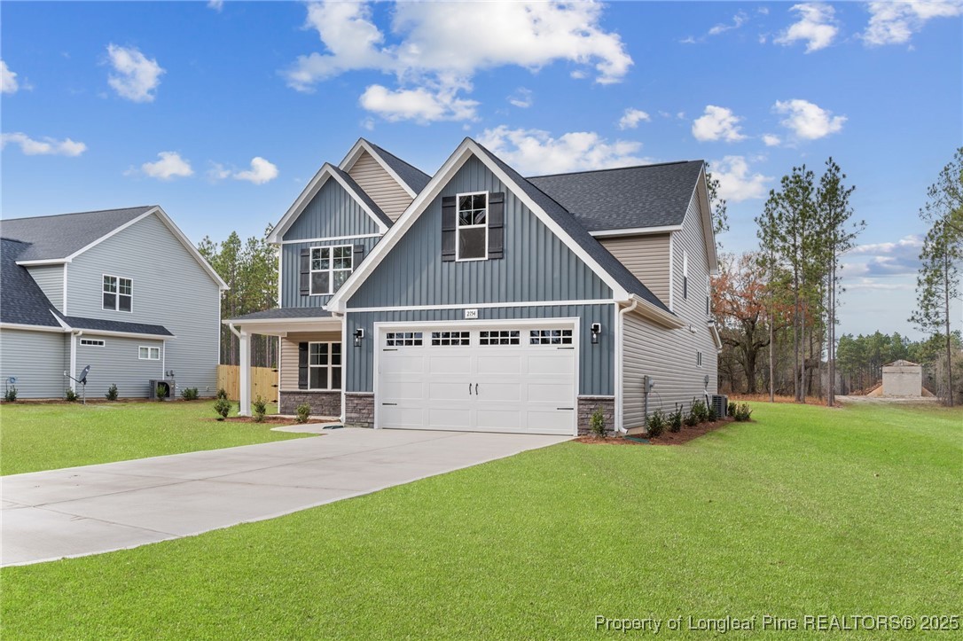 2154 Montrose (lot 6) Road Raeford, NC 28376 - Photo 4 of 44 a front view of house with yard and green space