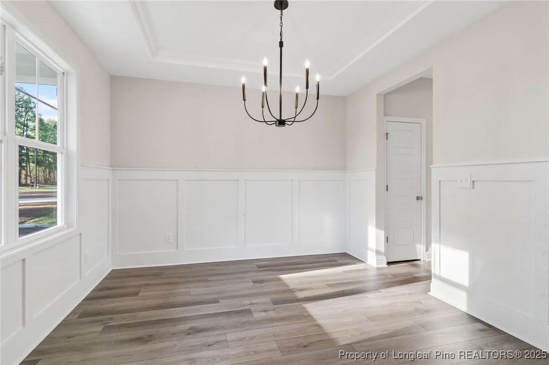 2154 Montrose (lot 6) Road Raeford, NC 28376 - Photo 6 of 44 a view of an empty room with wooden floor and windows