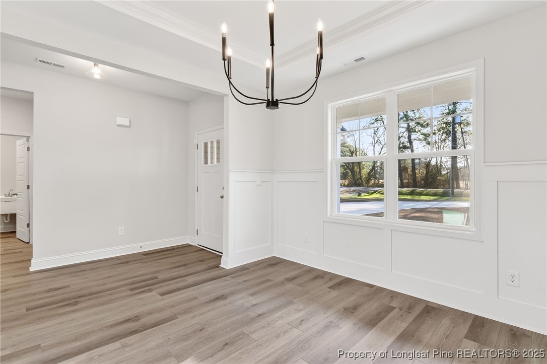 2154 Montrose (lot 6) Road Raeford, NC 28376 - Photo 7 of 44 a view of empty room with wooden floor and fan