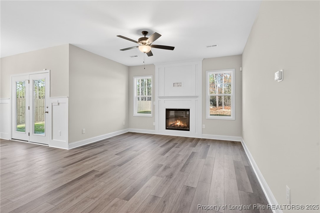 2154 Montrose (lot 6) Road Raeford, NC 28376 - Photo 10 of 44 a view of empty room with wooden floor and fireplace