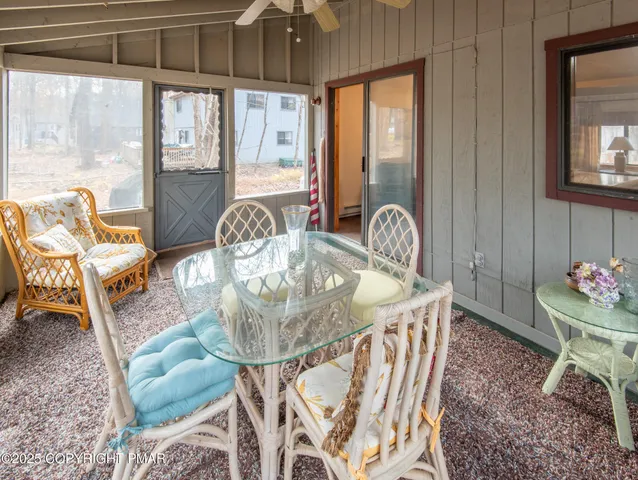 a dining room with furniture and window