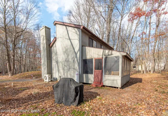 a view of a two chairs in the patio