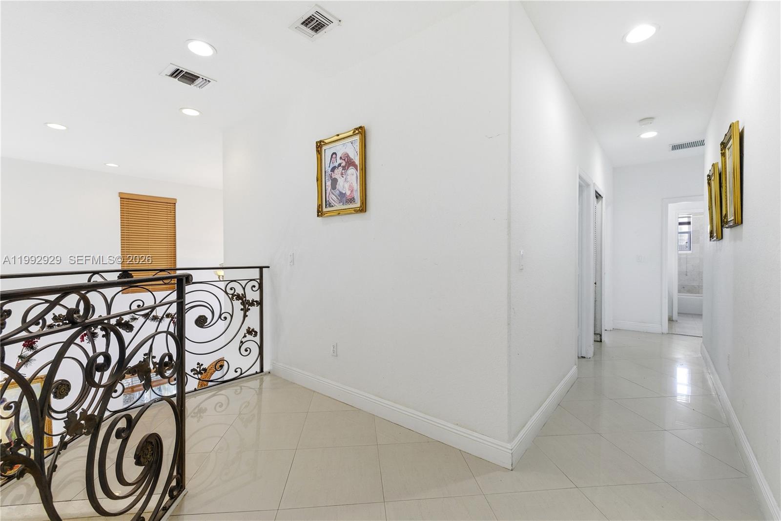 15184 Southwest 20th Street Miami, FL 33185 - Photo 25 of 39 a view of a hallway with wooden walls