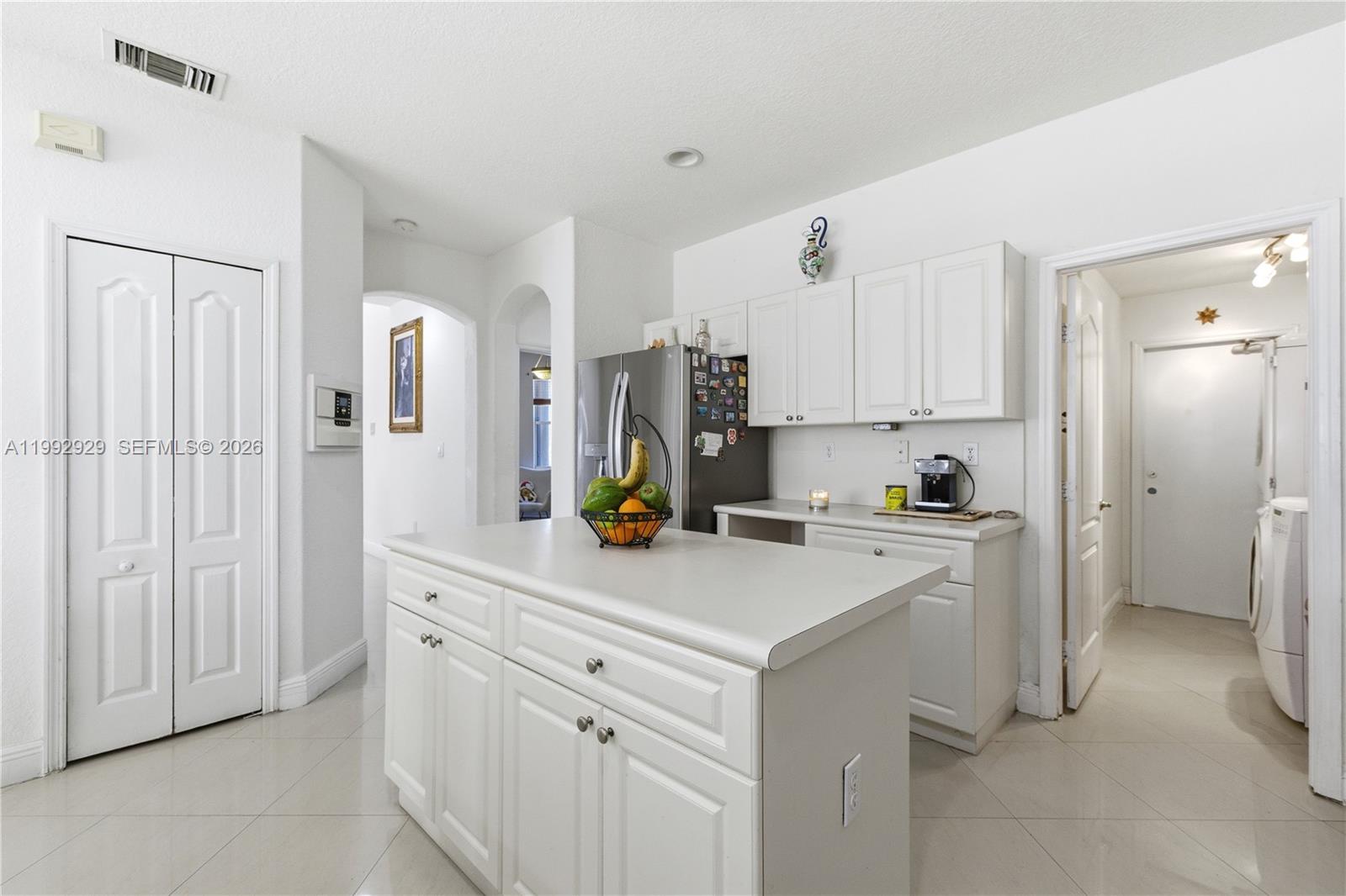 15184 Southwest 20th Street Miami, FL 33185 - Photo 30 of 39 a kitchen with cabinets and appliances