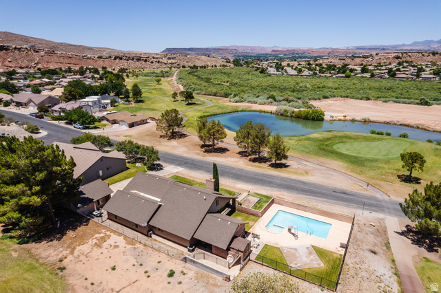 1470 Redwood Tree Street St. George, UT 84790 - Photo 43 of 53 Property featuring a private swimming pool, golf course frontage, and a tranquil body of water
