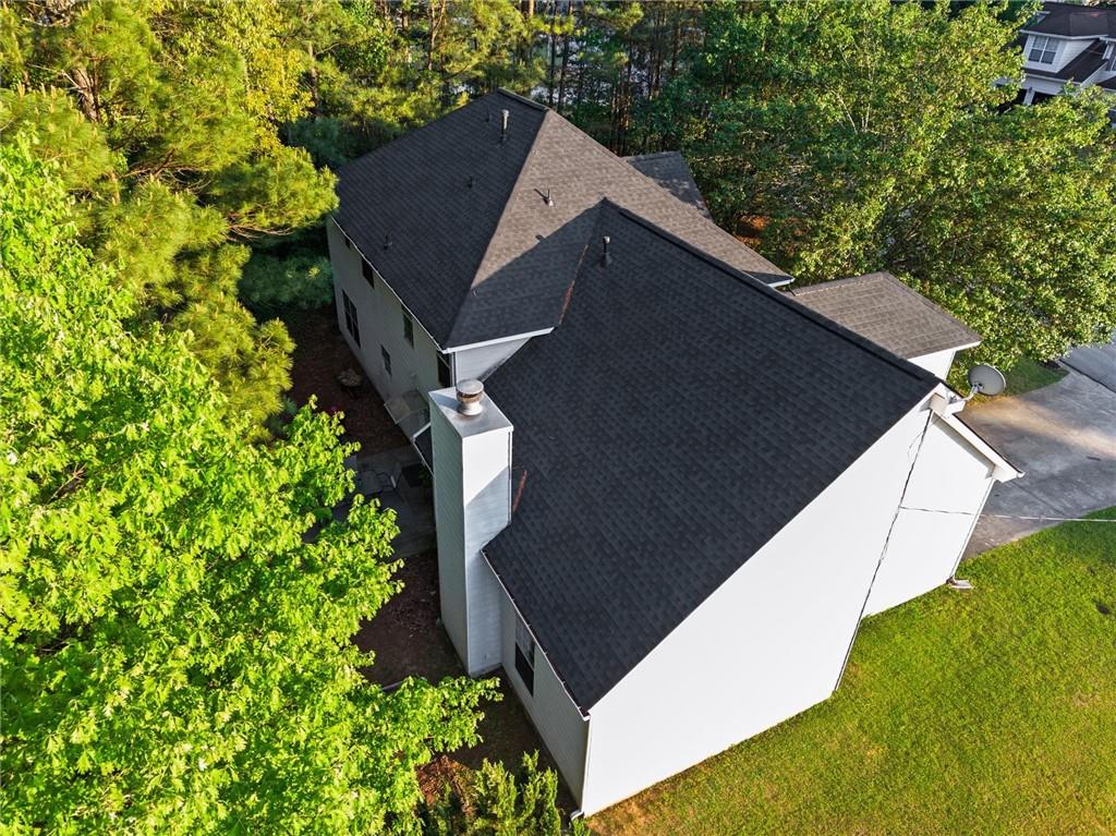 3234 Mineral Ridge Lane Stone Mountain, GA 30087 - Photo 47 of 55 a backyard of a house with lots of green space