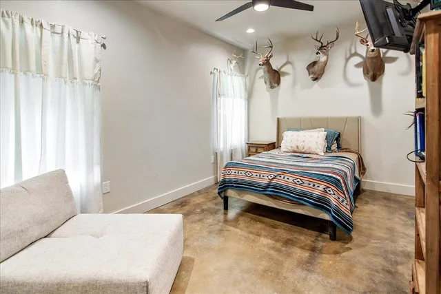 a bedroom with a bed and a chair