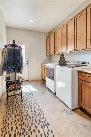 a kitchen with a stove a sink and a microwave