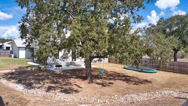 a backyard of a house with trees