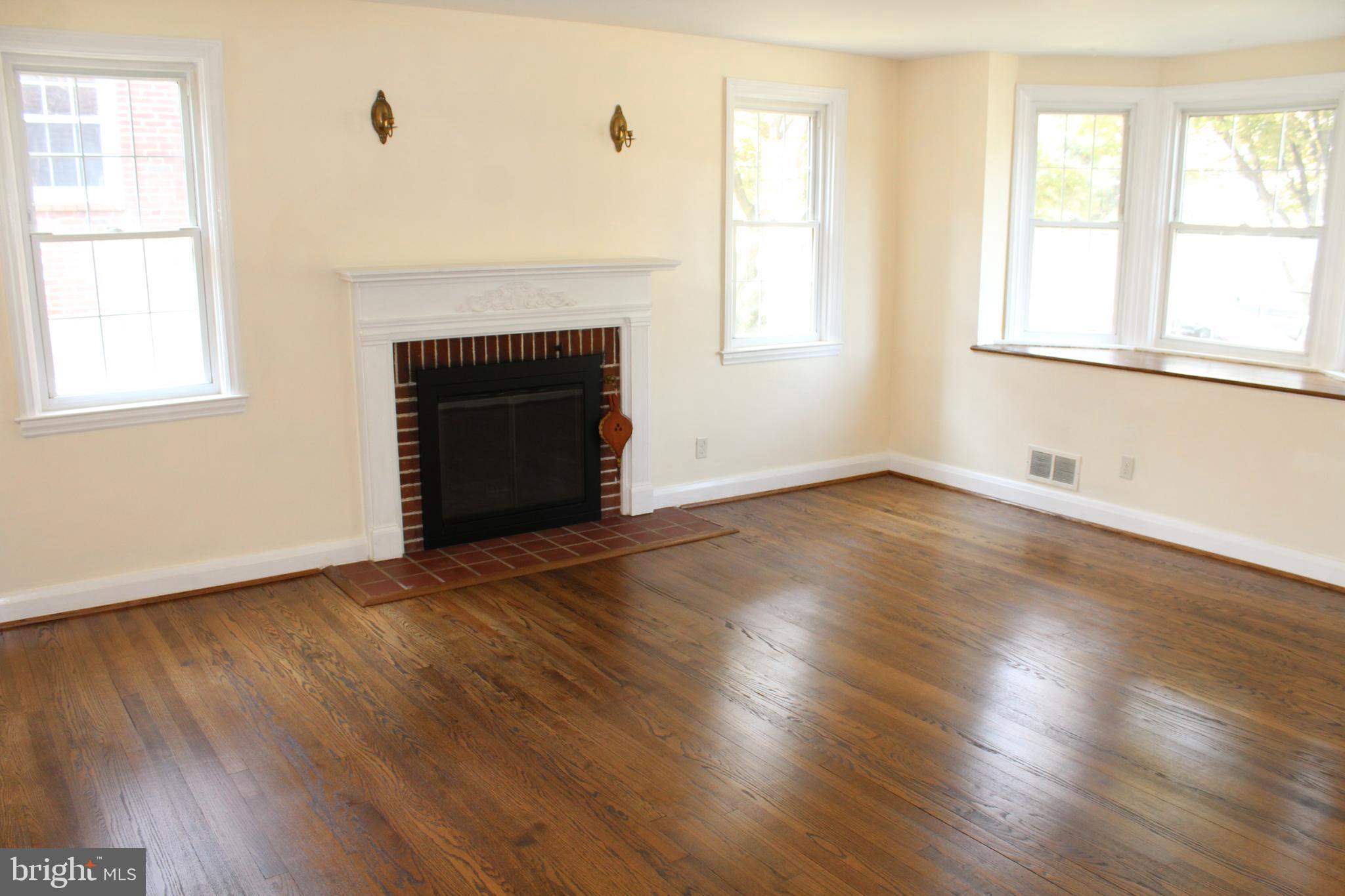 6119 Regent Park Road Baltimore, MD 21228 - Photo 19 of 55 Wood Burning Fireplace in Living Room