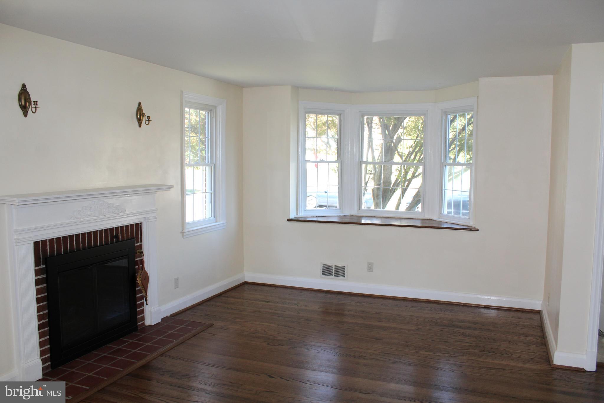 6119 Regent Park Road Baltimore, MD 21228 - Photo 22 of 55 Large Living room with Fireplace