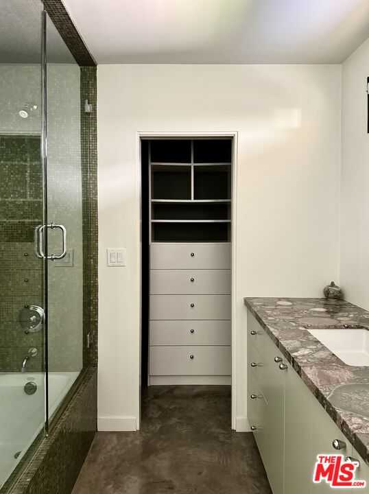 1555 Rising Glen Road Los Angeles, CA 90069 - Photo 17 of 19 a bathroom with a granite countertop sink and mirror