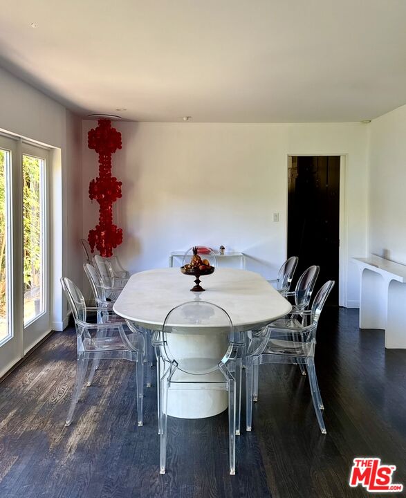 1555 Rising Glen Road Los Angeles, CA 90069 - Photo 8 of 19 a view of a dining room with furniture window and wooden floor