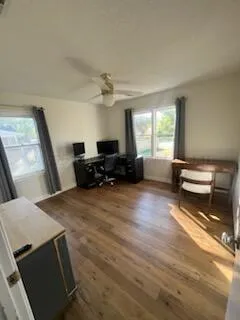 a living room with furniture stove and a window