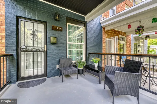 a balcony with furniture and windows