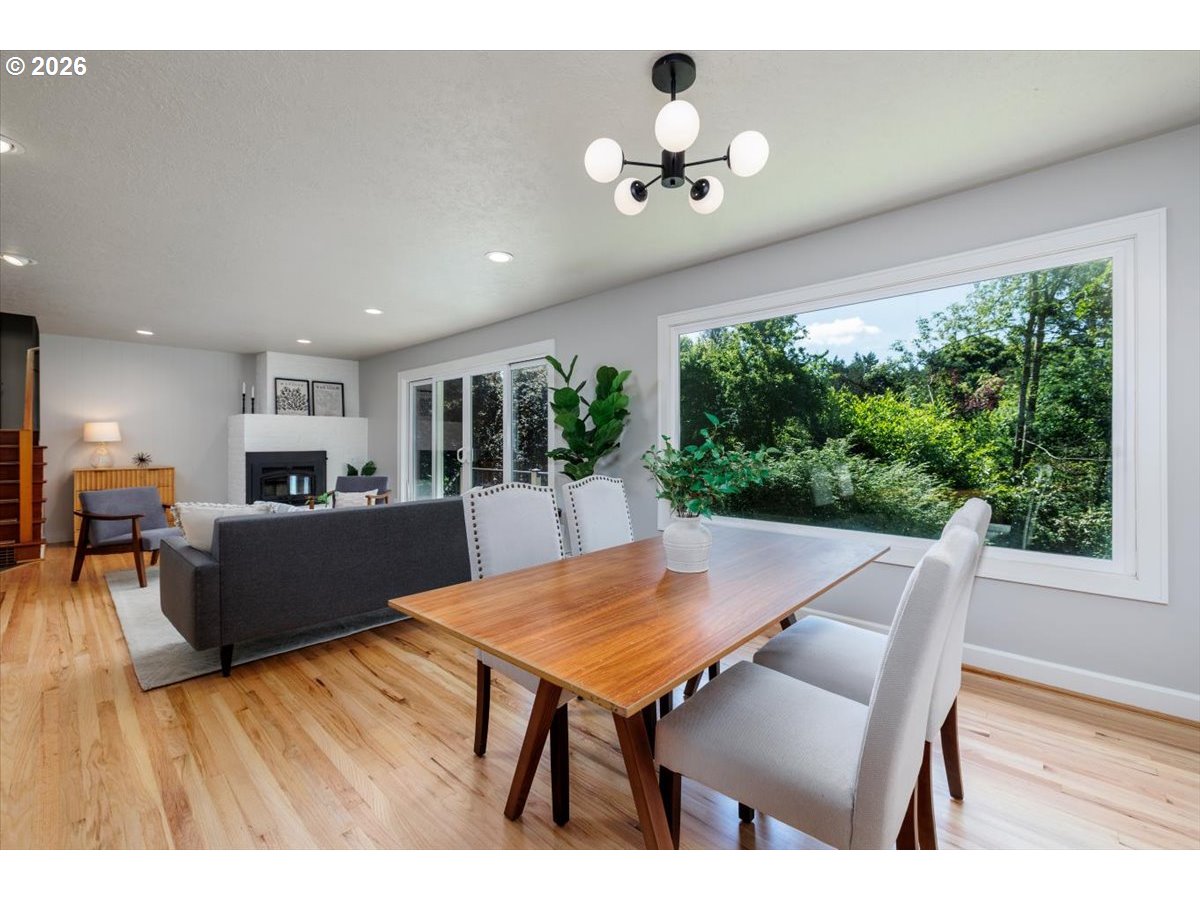 175 Northwest 95th Avenue Portland, OR 97229 - Photo 10 of 46 a view of a dining room with furniture window and wooden floor