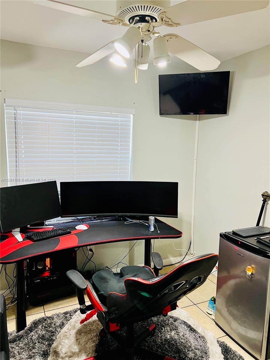 458 Southeast 3rd Street Hialeah, FL 33010 - Photo 11 of 13 a view of a workspace with furniture