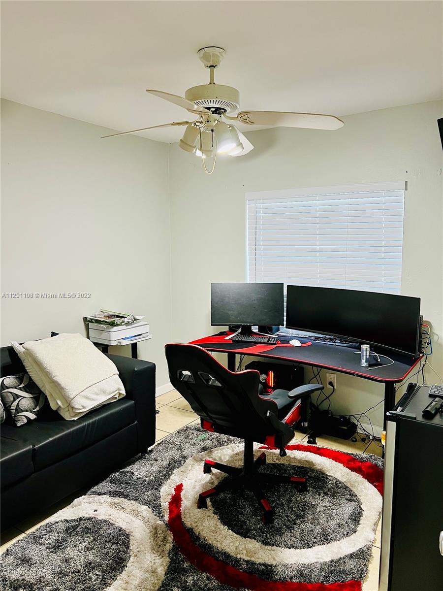 458 Southeast 3rd Street Hialeah, FL 33010 - Photo 12 of 13 a living room with furniture and a chandelier