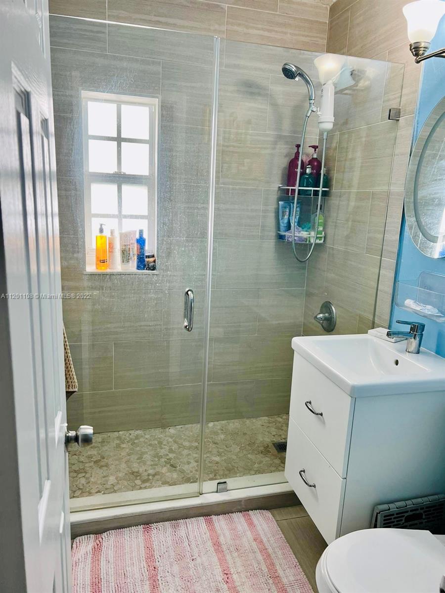 458 Southeast 3rd Street Hialeah, FL 33010 - Photo 13 of 13 a bathroom with a sink toilet and shower