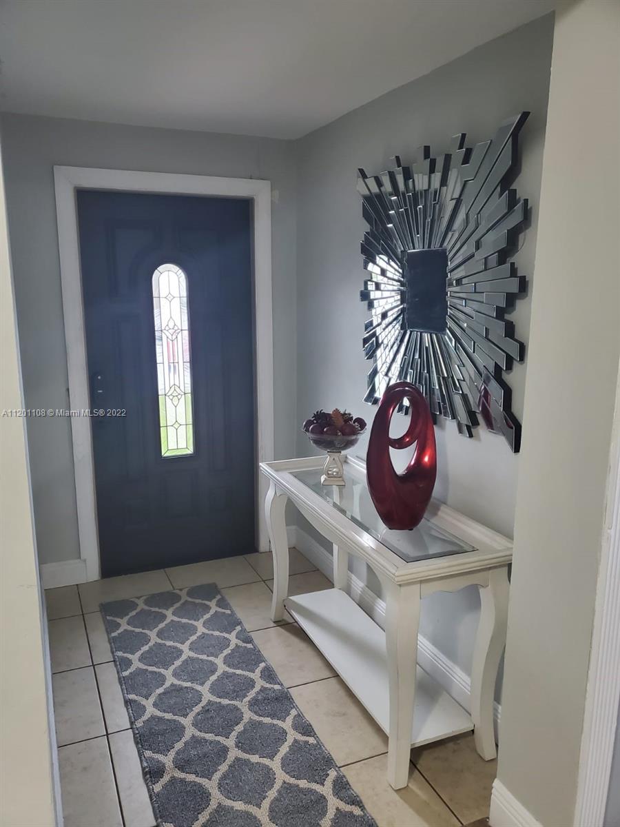 458 Southeast 3rd Street Hialeah, FL 33010 - Photo 2 of 13 a view of a small space with wooden floor