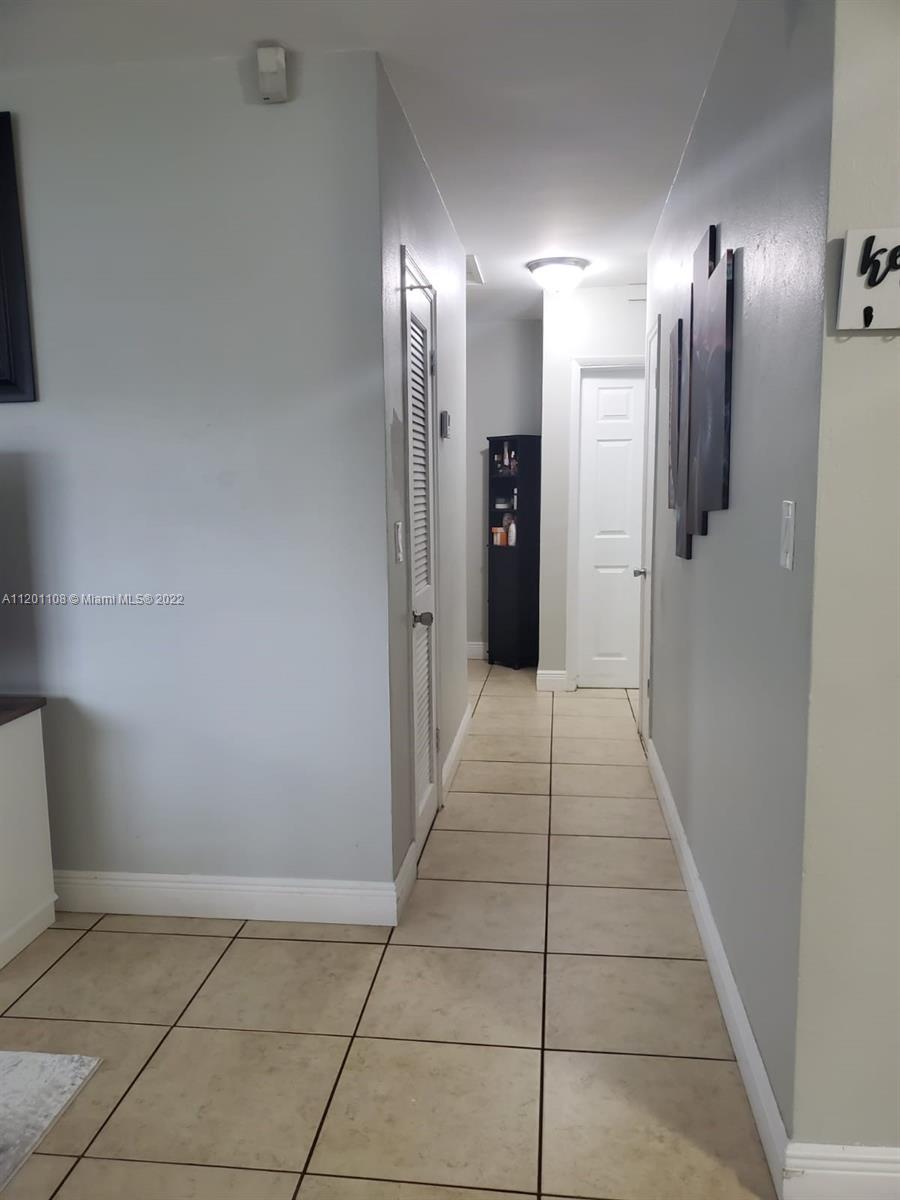 458 Southeast 3rd Street Hialeah, FL 33010 - Photo 4 of 13 a walk in closet with a bathroom