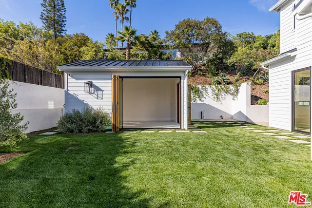 a house with garden in front of it