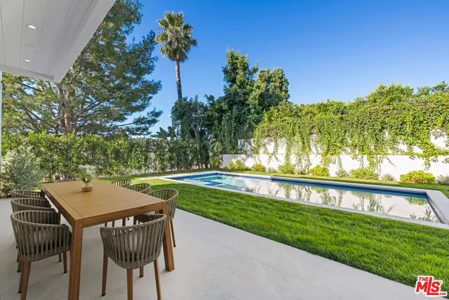 a view of a chairs and table in the garden