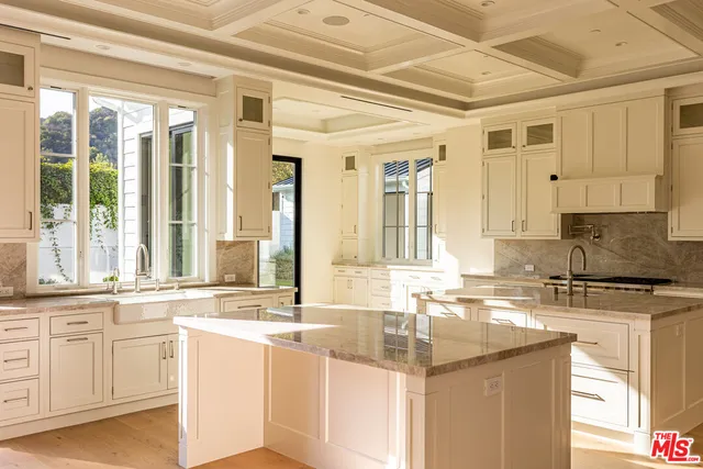 a kitchen with granite countertop a sink and a window