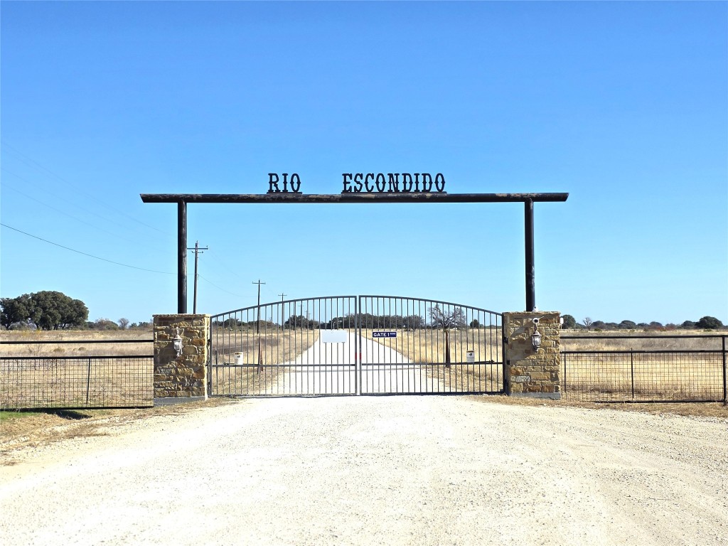 a view of a swimming pool with a yard