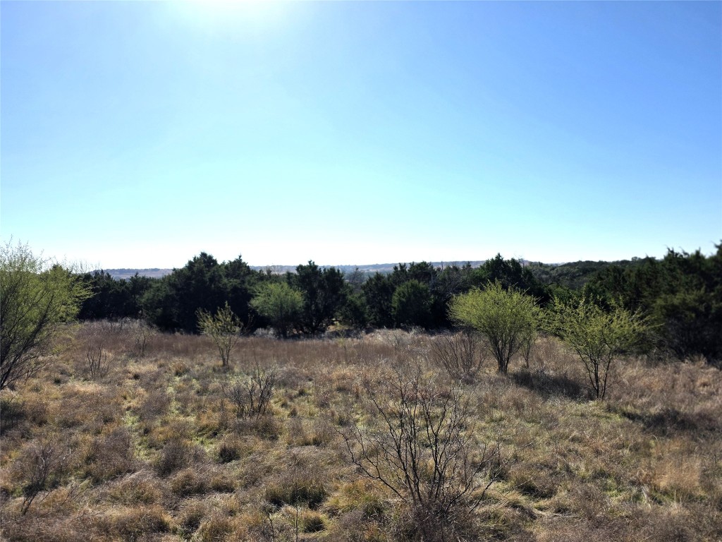 4218 Private Road 4218 Road Evant, TX 76525 - Photo 28 of 30 a view of a dry yard with mountains in the background