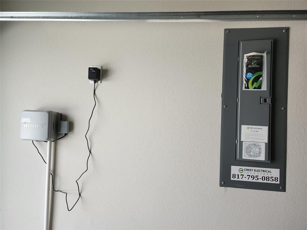 2309 Ruff Road Denton, TX 76205 - Photo 25 of 32 Sprinkler controls and Electrical panel in garage