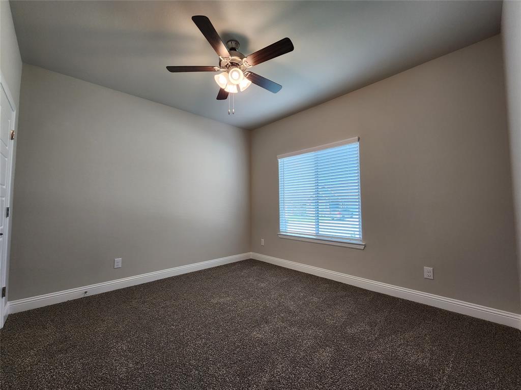 2309 Ruff Road Denton, TX 76205 - Photo 4 of 32 Bedroom 2 faces the front of the home