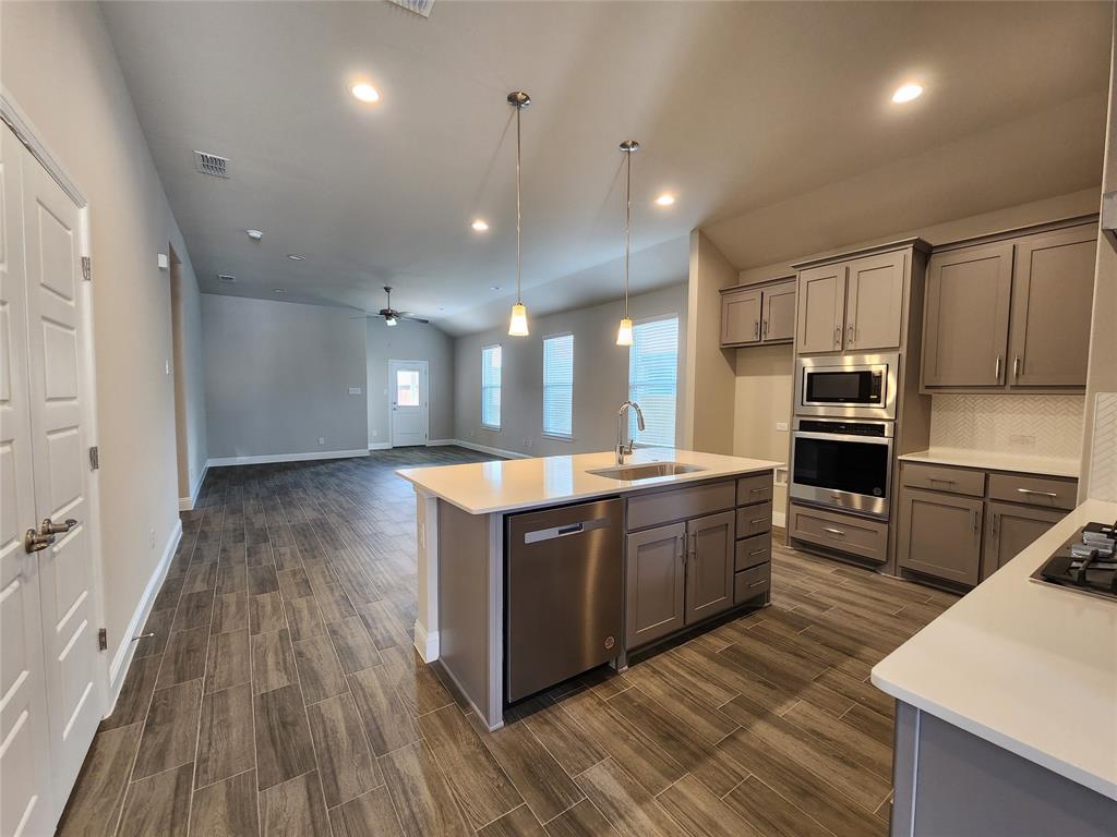 2309 Ruff Road Denton, TX 76205 - Photo 5 of 32 Great Kitchen island with ss dishwasher.