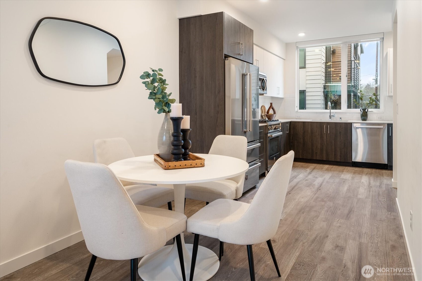 6309 9th Avenue Northeast, Unit D Seattle, WA 98115 - Photo 12 of 28 a view of a dining room with furniture and wooden floor