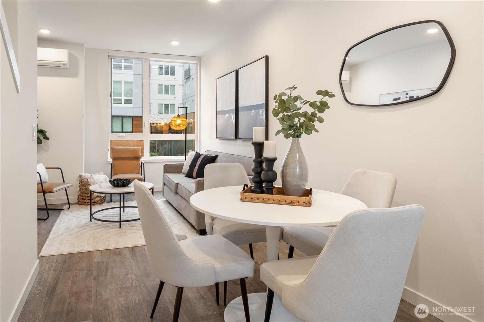 6309 9th Avenue Northeast, Unit D Seattle, WA 98115 - Photo 13 of 28 a view of a dining room with furniture and wooden floor