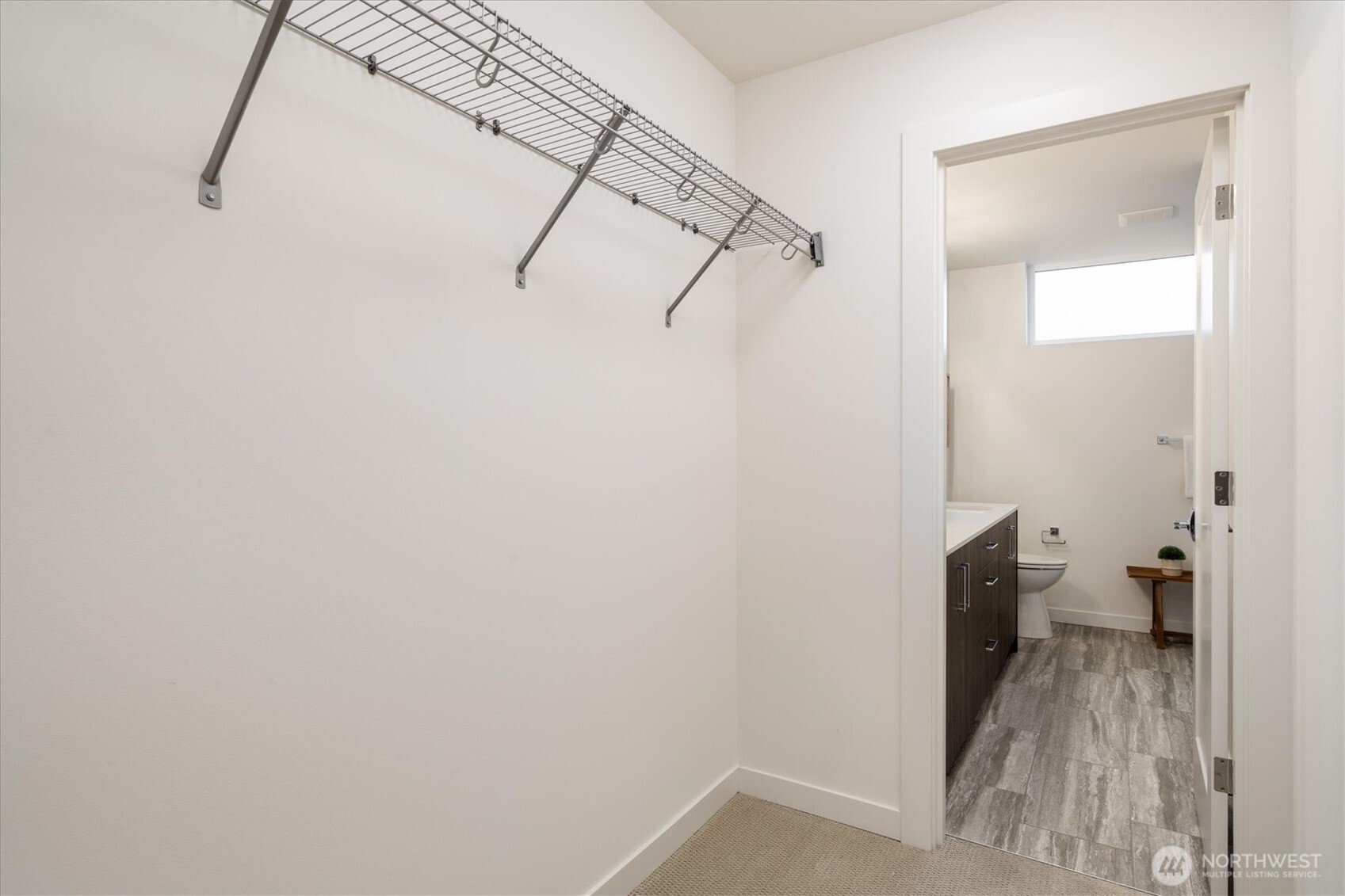 6309 9th Avenue Northeast, Unit D Seattle, WA 98115 - Photo 19 of 28 a view of a room with rack on the wall