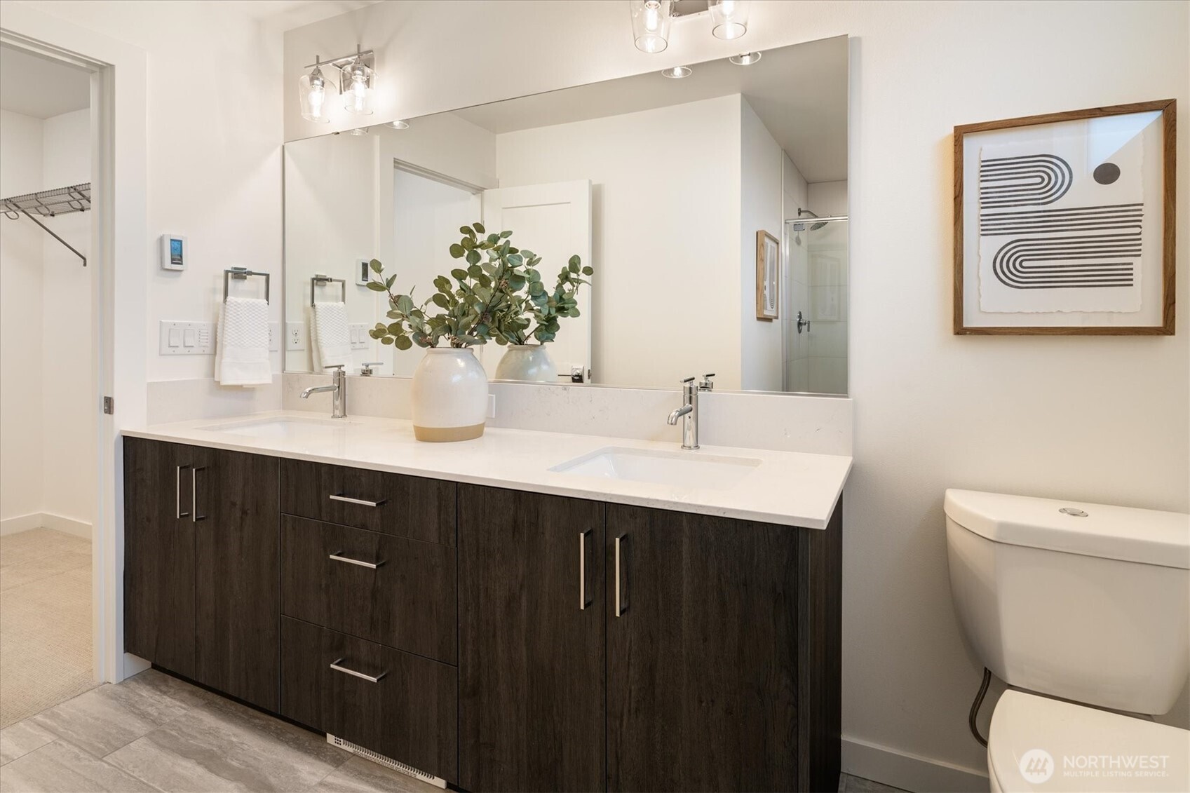 6309 9th Avenue Northeast, Unit D Seattle, WA 98115 - Photo 22 of 28 a bathroom with a sink and a mirror