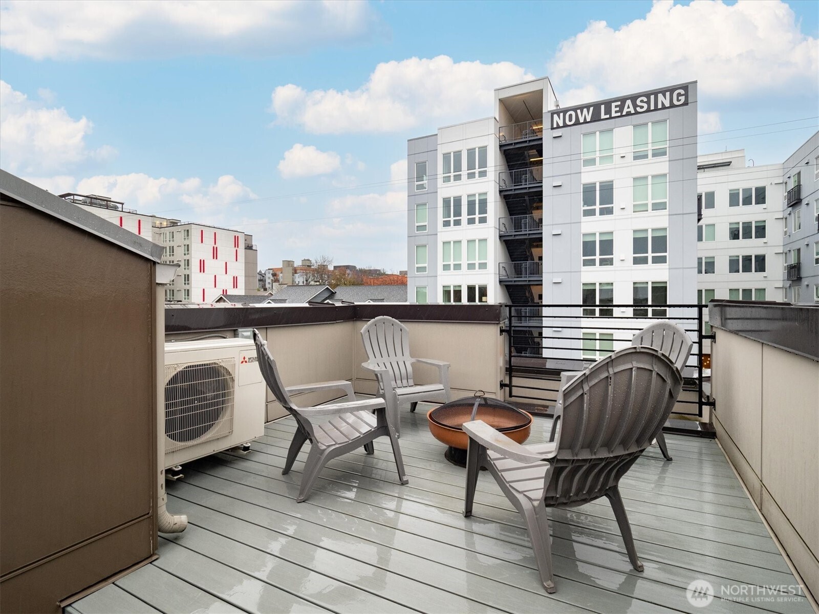 6309 9th Avenue Northeast, Unit D Seattle, WA 98115 - Photo 23 of 28 a table and chair sitting on a wooden floor