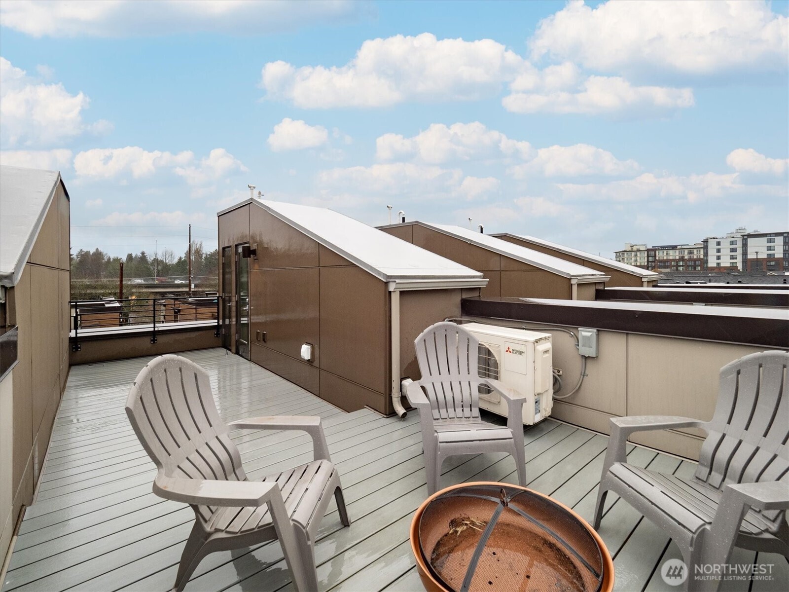 6309 9th Avenue Northeast, Unit D Seattle, WA 98115 - Photo 24 of 28 a view of roof deck with table and chairs