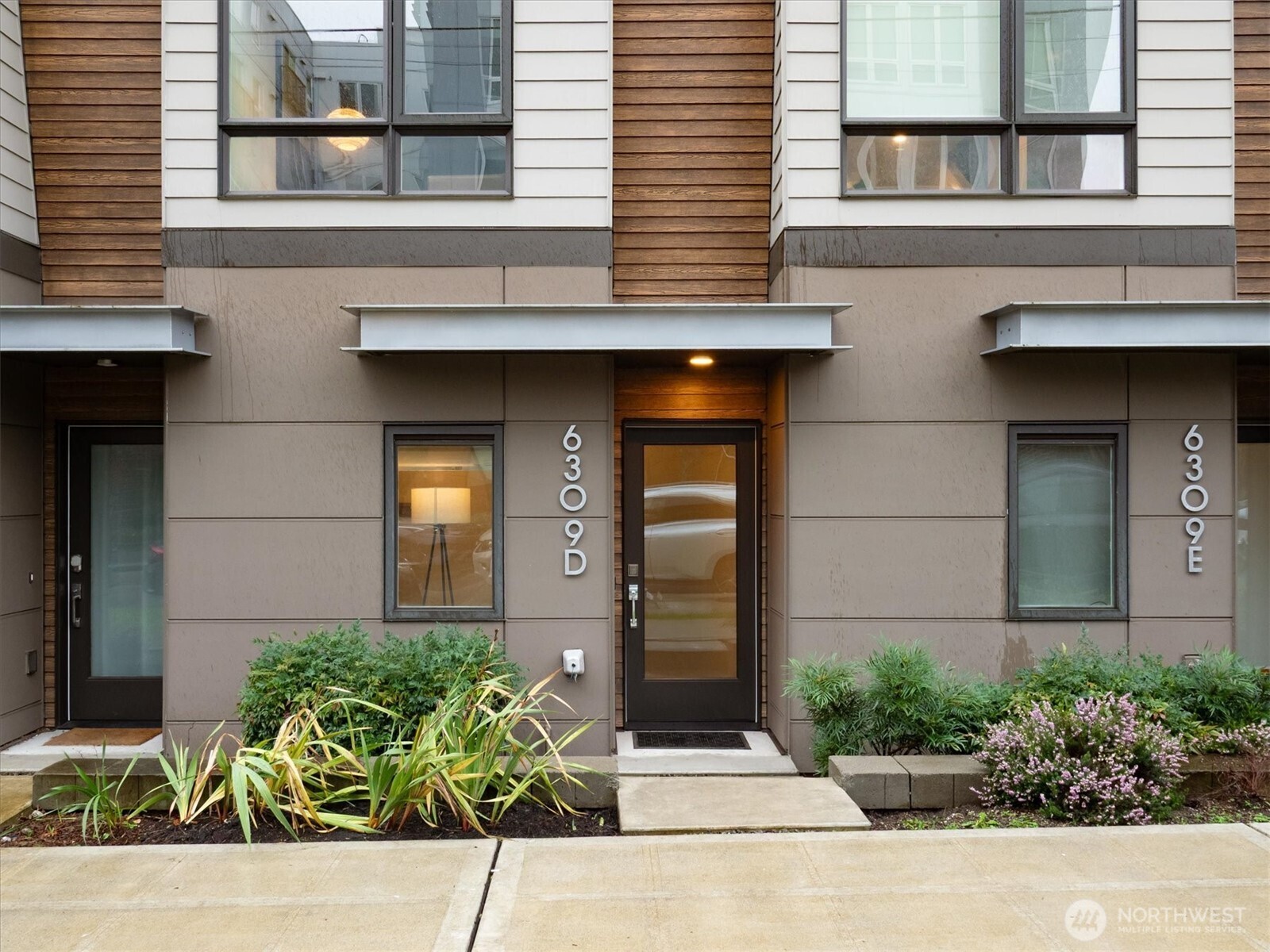 6309 9th Avenue Northeast, Unit D Seattle, WA 98115 - Photo 3 of 28 front view of a brick house with potted plants