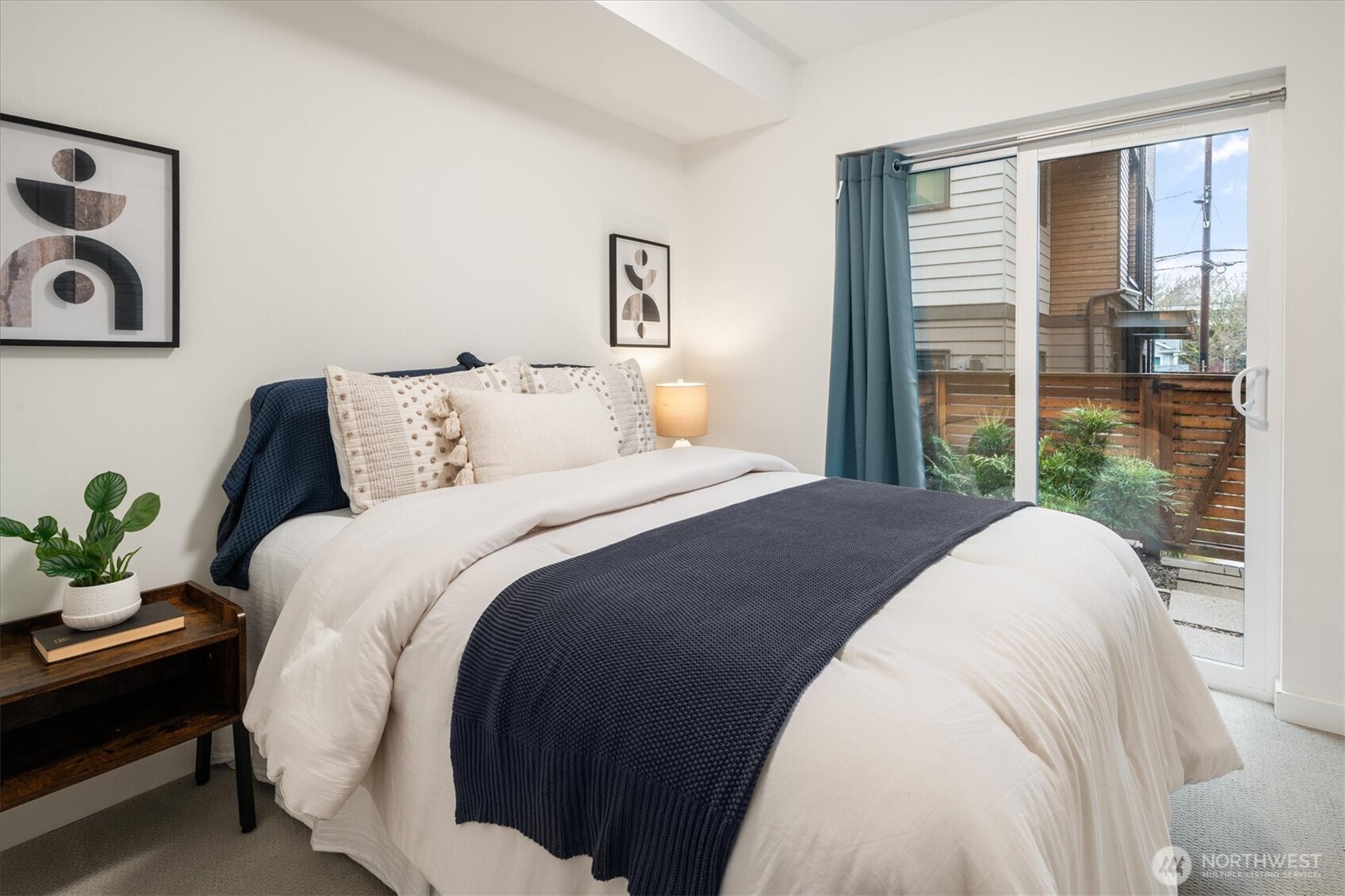 6309 9th Avenue Northeast, Unit D Seattle, WA 98115 - Photo 5 of 28 a bedroom with a bed and a window