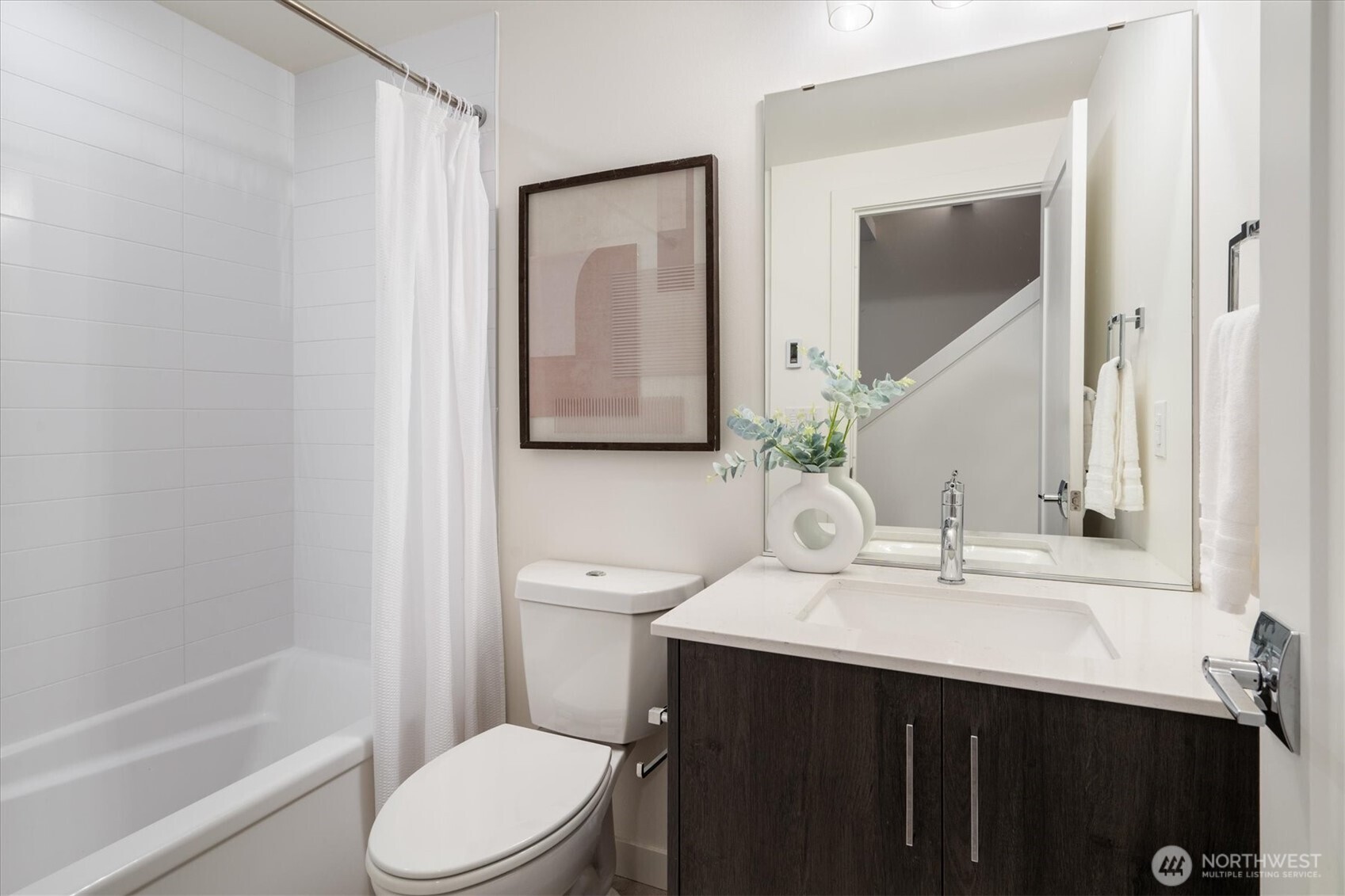 6309 9th Avenue Northeast, Unit D Seattle, WA 98115 - Photo 8 of 28 a bathroom with a sink vanity mirror and toilet