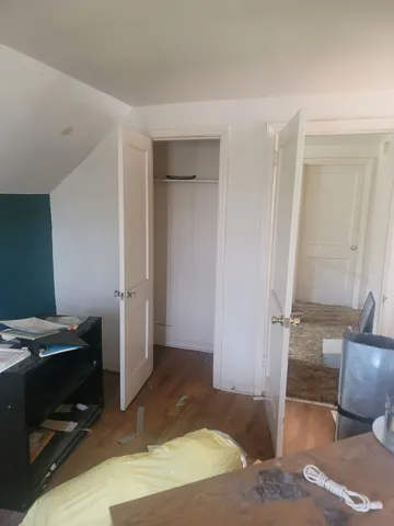 a view of small yard with wooden fence