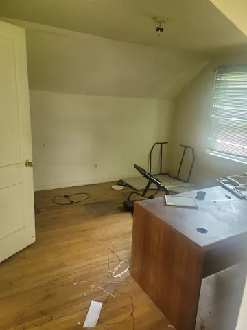 a backyard of a house with portable swimming pool and brick wall