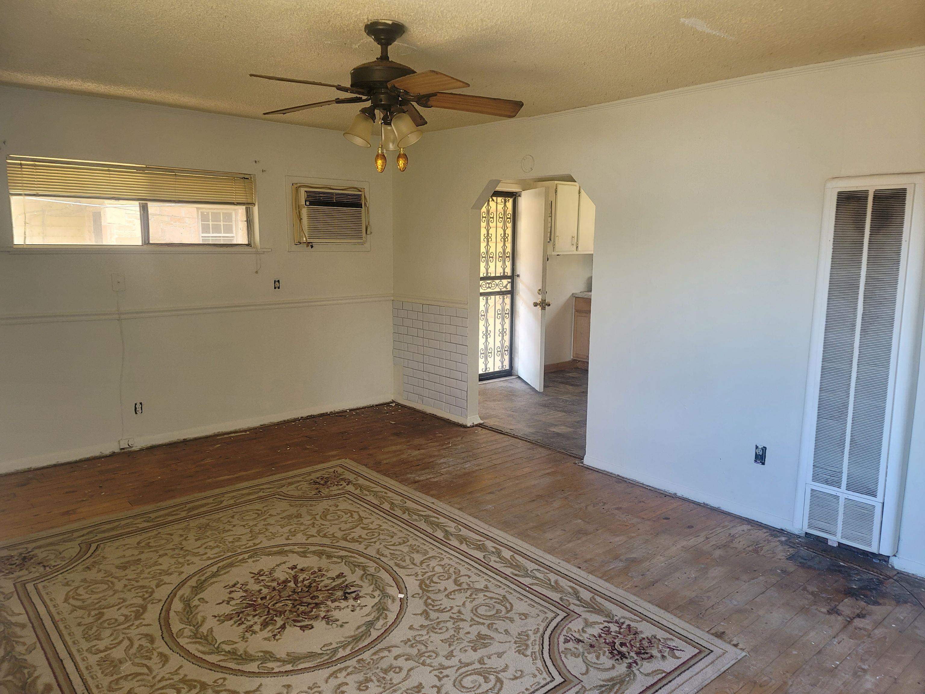 516 East Raines Road Memphis, TN 38109 - Photo 22 of 34 wooden floor in an empty room with a window