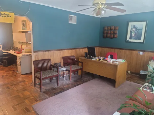 a living room with furniture and a window