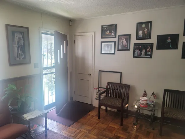 a living room with furniture and a window