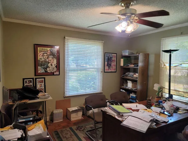 a workspace with furniture and a window