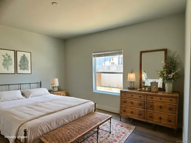 a bedroom with a bed and a dresser