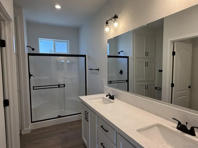a bathroom with a sink and mirror